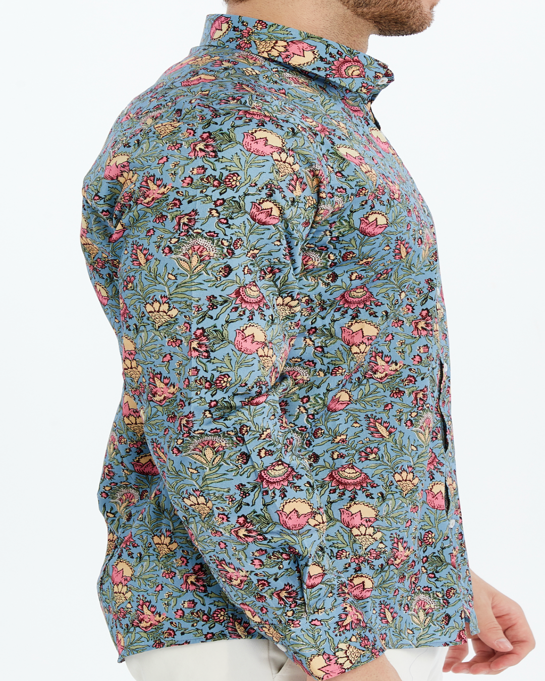 Man floral patterned print shirt on a lilac background