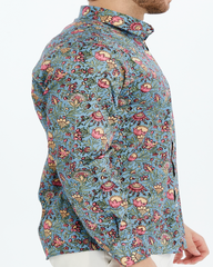 Man floral patterned print shirt on a lilac background
